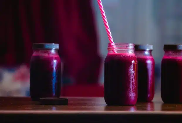 red beverage in mason jars